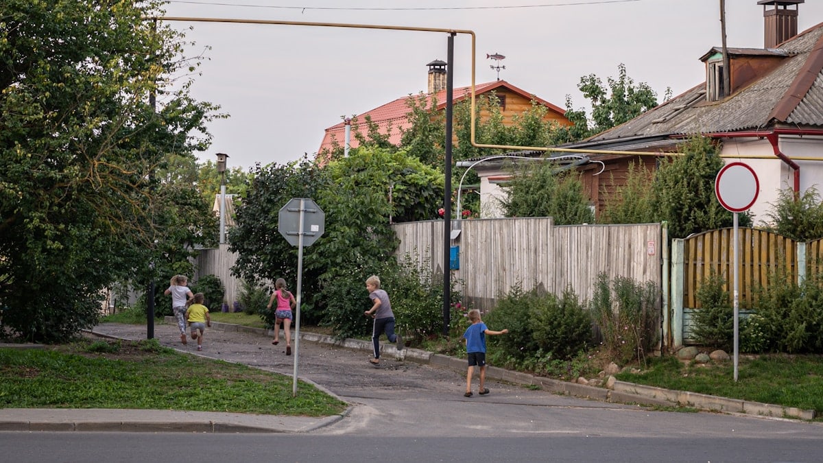 a group of people walking down a street